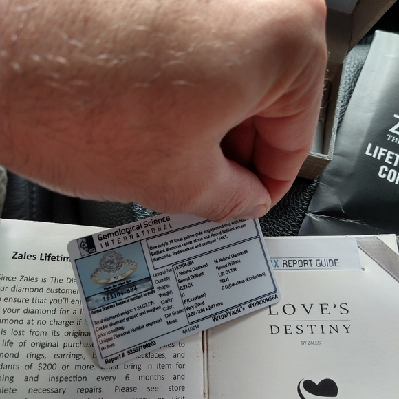 An engagement ring and man's wedding band . - Picture 5 of 10